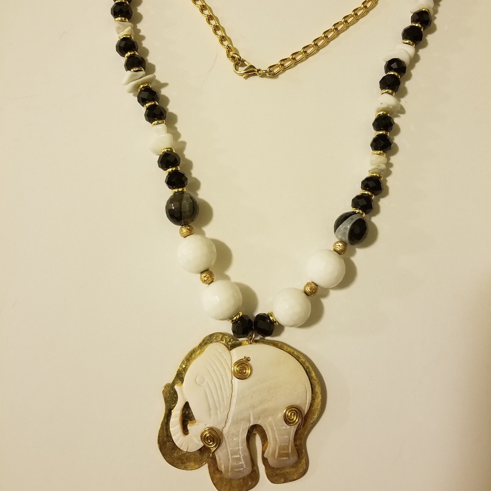 a necklace with an elephant to be part of your clo